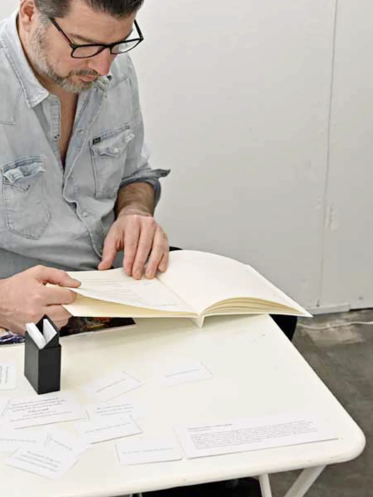 Person reading at a desk.